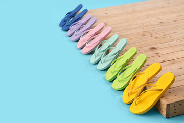 Many different flip-flops on blue background