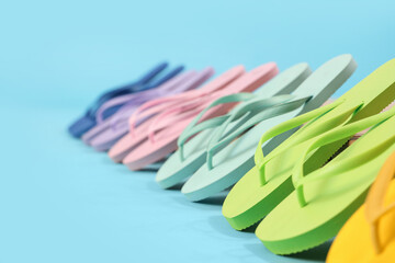 Many different flip-flops on blue background