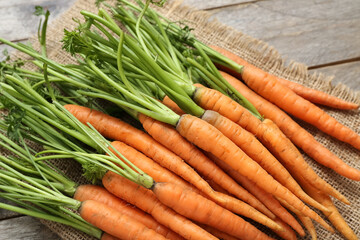 Fresh carrots on wooden background