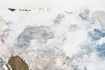 Texture of an old mud wall repaired with stucco and plaster as grunge background