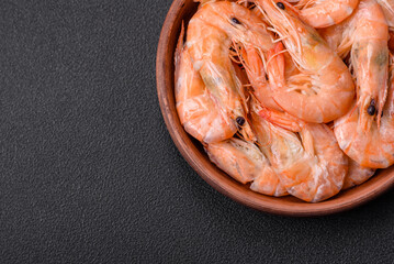 Delicious fresh boiled tiger prawns with salt and spices on a ceramic plate