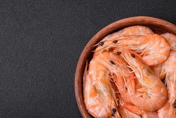 Delicious fresh boiled tiger prawns with salt and spices on a ceramic plate