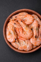 Delicious fresh boiled tiger prawns with salt and spices on a ceramic plate