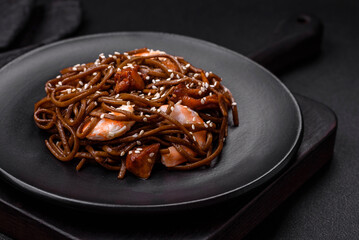 Delicious fresh buckwheat noodles with boiled tiger prawns, salt, spices and mushrooms