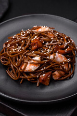Delicious fresh buckwheat noodles with boiled tiger prawns, salt, spices and mushrooms