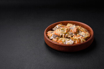 Delicious boiled beef or pork tongue sliced with carrots, onions, sour cream and spices