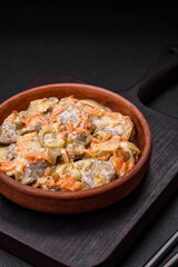 Delicious boiled beef or pork tongue sliced with carrots, onions, sour cream and spices