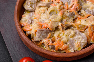 Delicious boiled beef or pork tongue sliced with carrots, onions, sour cream and spices