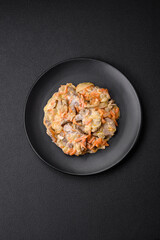 Delicious boiled beef or pork tongue sliced with carrots, onions, sour cream and spices