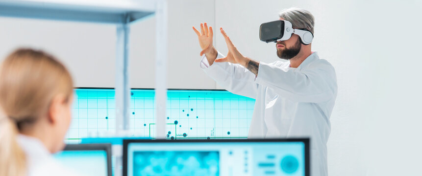 Team of professional scientists working on a vaccine in a modern scientific research laboratory. Genetic engineer workplace. Future technology, healthcare and science concept. - Powered by Adobe