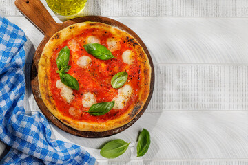 Margarita pizza with tomatoes, mozzarella cheese and basil
