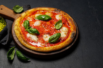 Margarita pizza with tomatoes, mozzarella cheese and basil