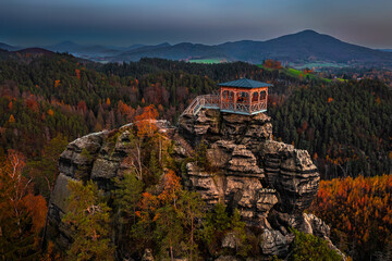 Jetrichovice, Czech Republic - Aerial view of Mariina Vyhlidka (Mary's view) lookout with a beautiful Czech autumn landscape and blue sunset sky in Bohemian Switzerland region