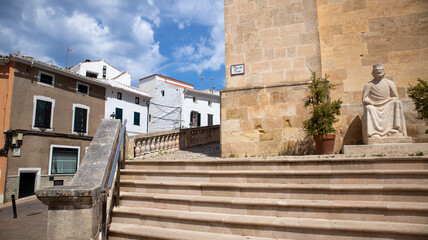 Fototapeta na wymiar Alaior, Menorca , cultural center of the island. street view and architecture. white houses an church