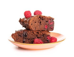 Plate with pieces of raspberry chocolate brownie on white background