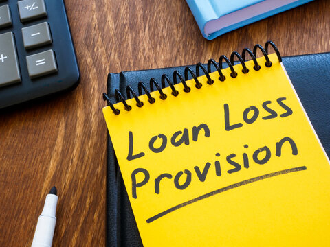 Loan loss provision handwritten in a notepad.