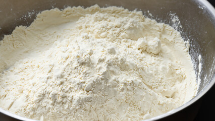 A mixing bowl full of flour.