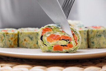 Zucchini roll stuffed with cream cheese and salmon. Healthy and tasty eating ideas.