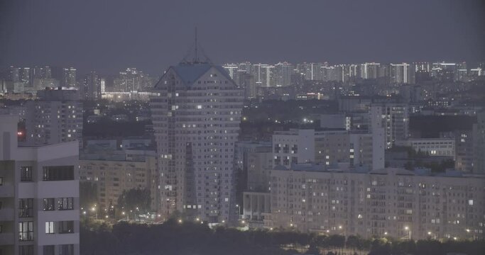 Modern Multi-storey Residential House. Elevated View Cityscape Skyline. Night Light Lighting Timelapse. Backdrop Night Time Lapse. Urban Cityscape At Evening Time. Ungraded, Canon, C-log, C Log, Log.