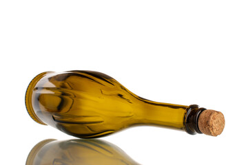 One empty glass bottle with cork, macro, isolated on white background.