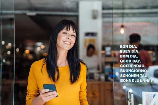 Happy father carrying son on shoulders at home