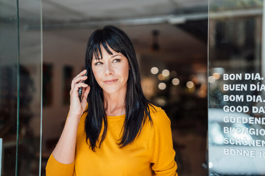 Happy children embracing mother at home