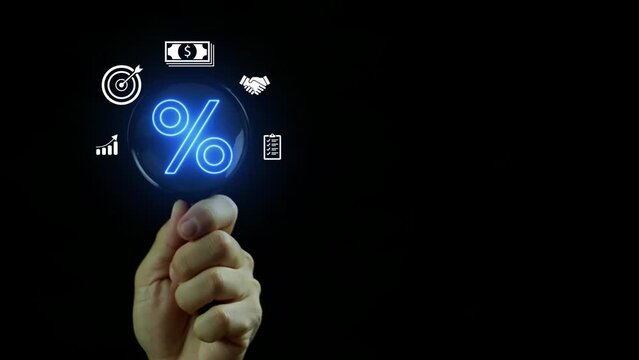 Human hand with magnifying glass focus on percentage icon. Profit high growth percent icon, stocks, financial, ranking, mortgage rates, Interest rate and dividend concept.