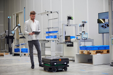 Smiling woman leaning on railing at sunset