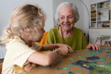 Happy family using laptop together at home