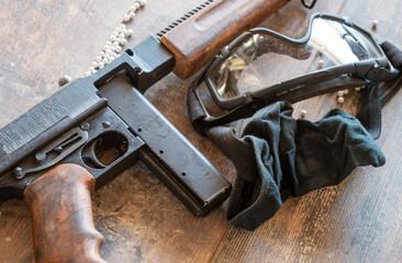 airsoft gun with glasses and lot of bullets