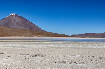 Picturesque Laguna Verde with Licancabur Volcano, just one natural sight while traveling the scenic lagoon route through the Bolivian Altiplano