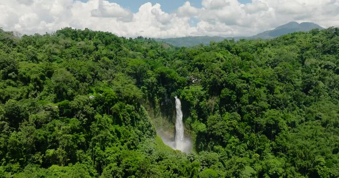 A beautiful waterfall among the rainforest and vegetation. Hikong Bente in Lake Sebu, South Cotabato. Mindanao, Philippines.