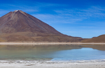 Picturesque Laguna Verde with Licancabur Volcano, just one natural sight while traveling the scenic lagoon route through the Bolivian Altiplano