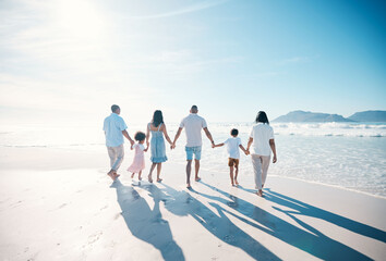 Travel, beach and big family walking on vacation together at the sea or ocean bonding for love and...
