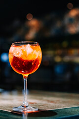 alcohol cocktail in a glass stands on a table in a bar or restaurant