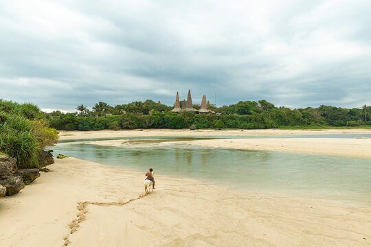 Marapu Sumba Tribe gracefully rides a horse along the shoreline