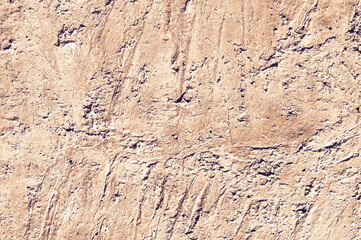 Yellow stone texture close-up. Rough yellow stone wall. Natural rock texture