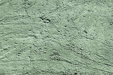 Green stone texture close-up. Rough green stone wall. Natural rock texture