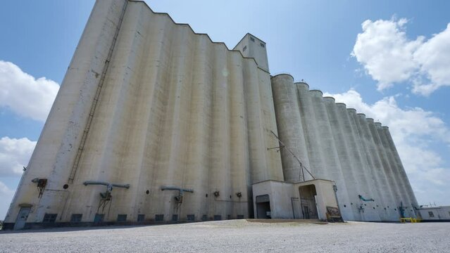 Large Grain Elevator Structure Time Lapse In Day Time Sun