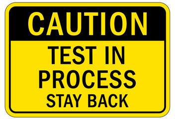 Testing in progress warning sign and labels test in process, stay back