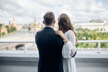 bride and groom walking on the street