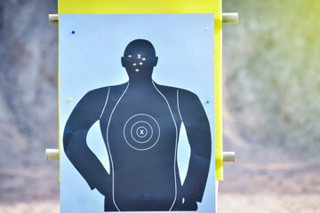 Hole in the gun shooting training target from shooter shooter.
