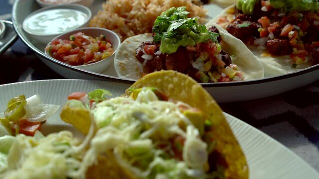 Soft taco tacos carnitas paprika pork guacamole salsa hard shell with cheese