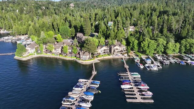 lake arrowhead village california lakeside homes with boat docks and pine tree forest AERIAL TRUCKING PAN