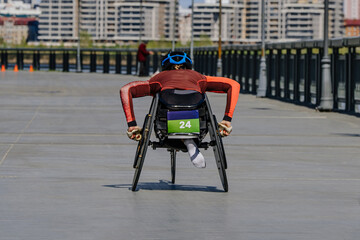 female para athlete in wheelchair racing marathon race, sports summer games para athletics