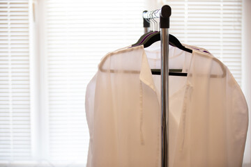 Medical white coats hanging on a hanger