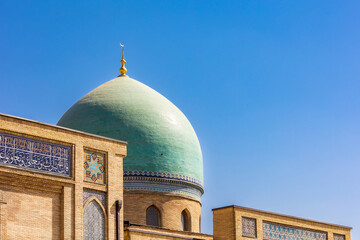 Close-up. The blue dome of a Muslim mosque against the blue sky. Eastern religion.