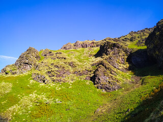 Beautiful mountain landscape with green meadow and blue sky in India