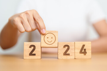 Smile face with 2024 block.  Satisfaction, feedback, Review, mental health, eco sustainable and...