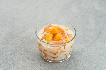 Mango Cheese Milk, a dessert made from jelly, nata de coco, basil seed, sweet mango, cream cheese and milk.
